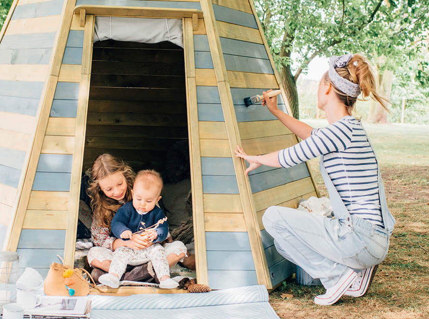 Parent painting teepee