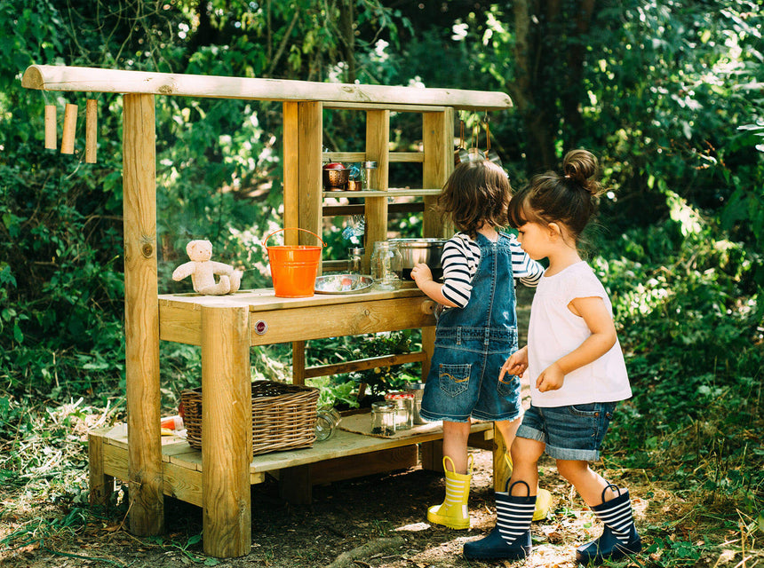 children playing with Plum Play mud pie kitchen